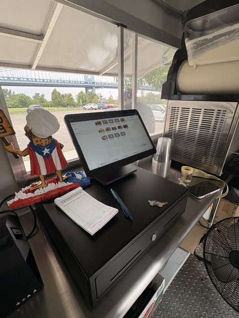 Register station inside the CoquiEats food truck