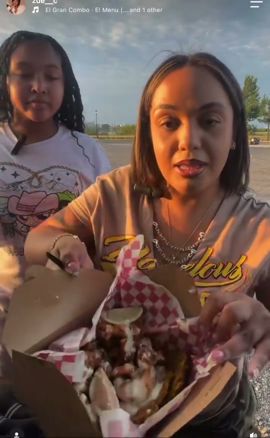 A satisfied CoquiEats customer sharing her experience at the truck