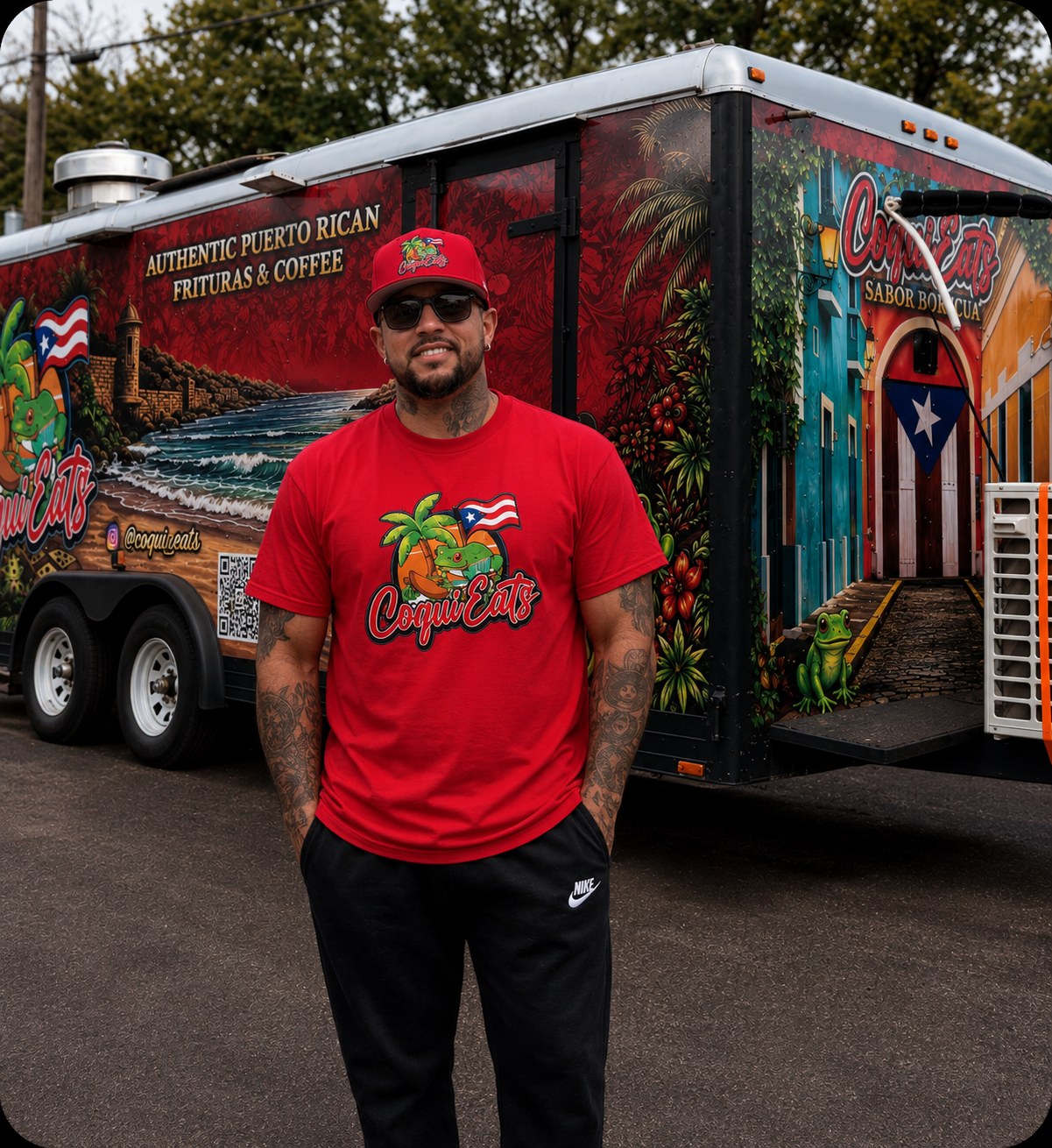 Alex Vazquez in a red CoquiEats shirt standing in front of the CoquiEats food truck
